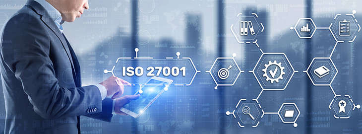 businessman completing an ISO 2001 checklist on a tablet