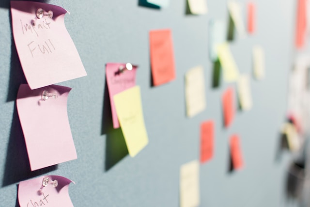 sticky notes on bulletin board