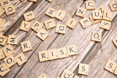 Risk on wooden letters
