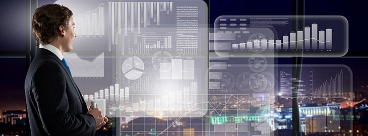 businessman examining graphs and metrics projected on an office window