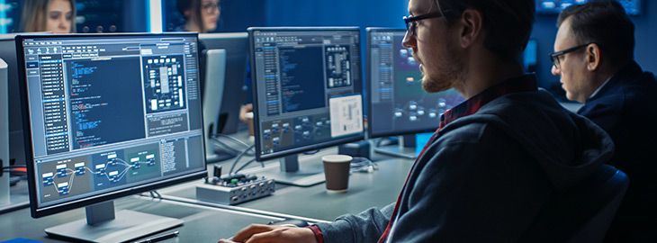 cyber security professionals working on computers