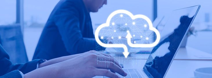 businessman working on laptop with digital cloud hovering above
