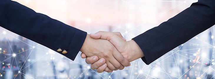 businesswomen shaking hands