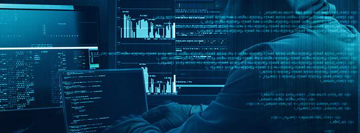 hooded hacker executing a cyber attack