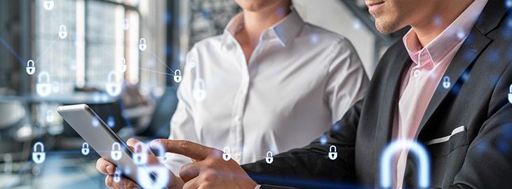 Businessman and businesswoman working together to protect clients confidential information and cyber security