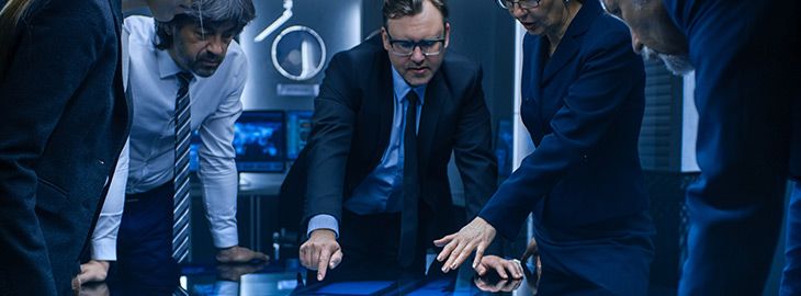 information security team discussing strategy in a board room