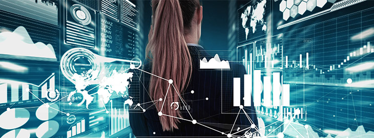 businesswoman observing risk metrics and other analytical data displayed on a large screen