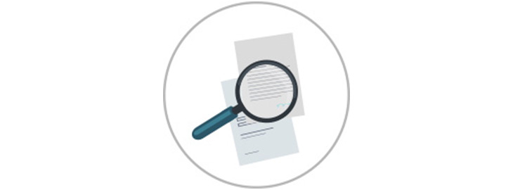 magnifying glass looking at documents