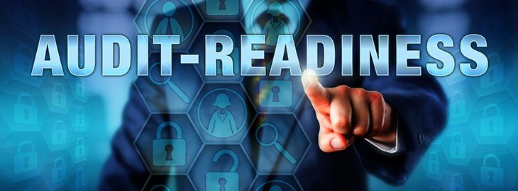 businessman tapping Audit-Readiness on touchscreen containing digital security icons