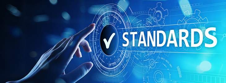 female hand tapping standards check icon on touchscreen