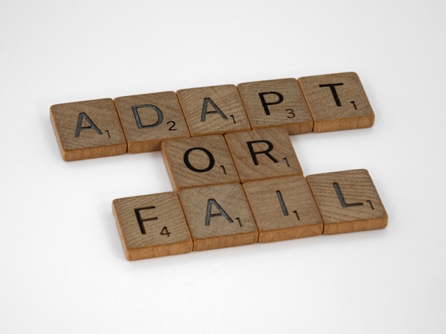 wooden blocks with black letters that spell out "Adapt or fail"