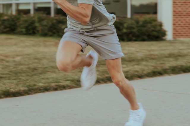 person running on sidewalk