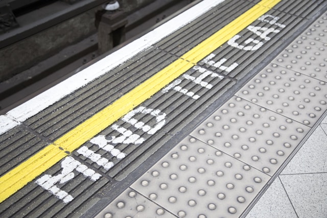 "Mind the gap" painted on London train stop