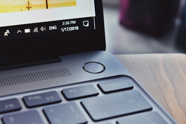black laptop keyboard with fingerprint scanner